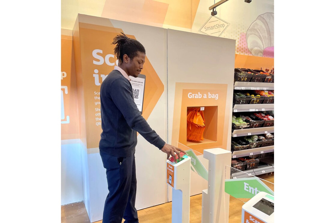 A man enters and shops at the new Sainsbury's location at Holborn Circus, using Amazon's Just Walk Out technology.