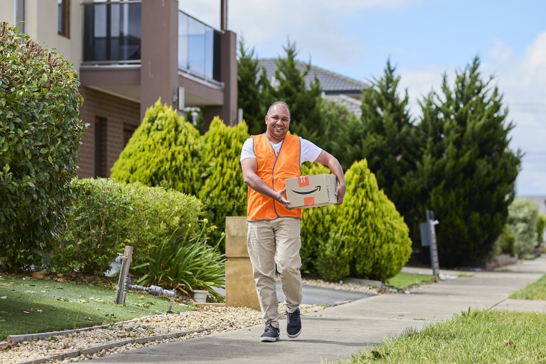 Amazon Flex DP Mohammad walking with Amazon box