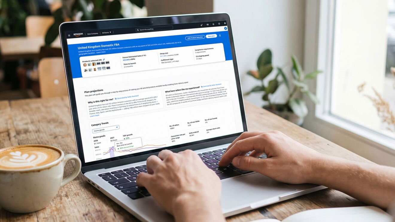 Hands typing on a laptop displaying Amazon FBA UK domestic plan dashboard