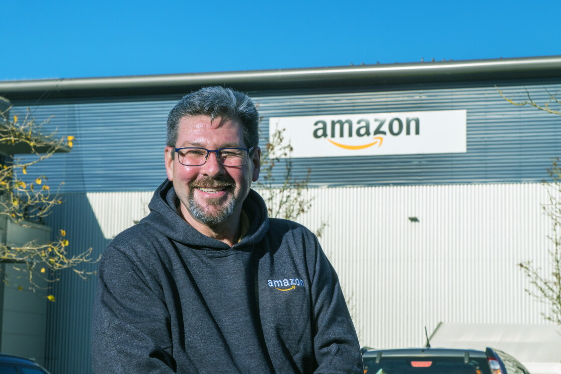 Andrew Norman, FC Associate, Hemel Hempstead standing in front of a Fulfilment Centre.