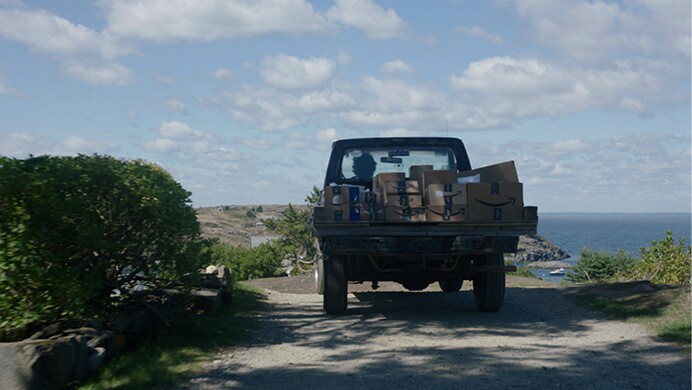 Amazon packages travel by boat, vehicle, and are delivered directly to customers.