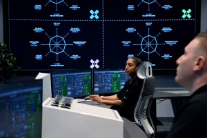 Woman on a control panel for X energy