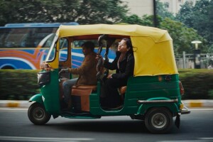 A photo of Vani Agarwal riding in the back passenger seat of a vehicle.