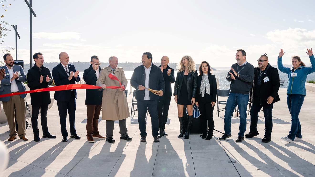 Mayor Bruce Harrell cutting the ribbon at the opening ceremony of the Overlook Walk in Seattle.