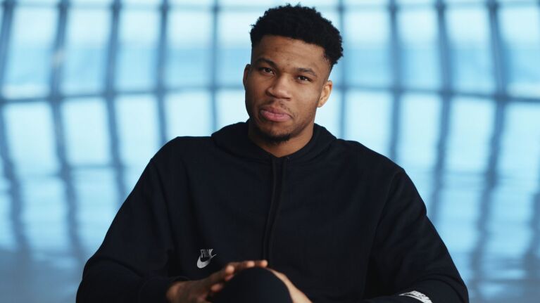 NBA star Giannis Antetokounmpo talks during an interview.