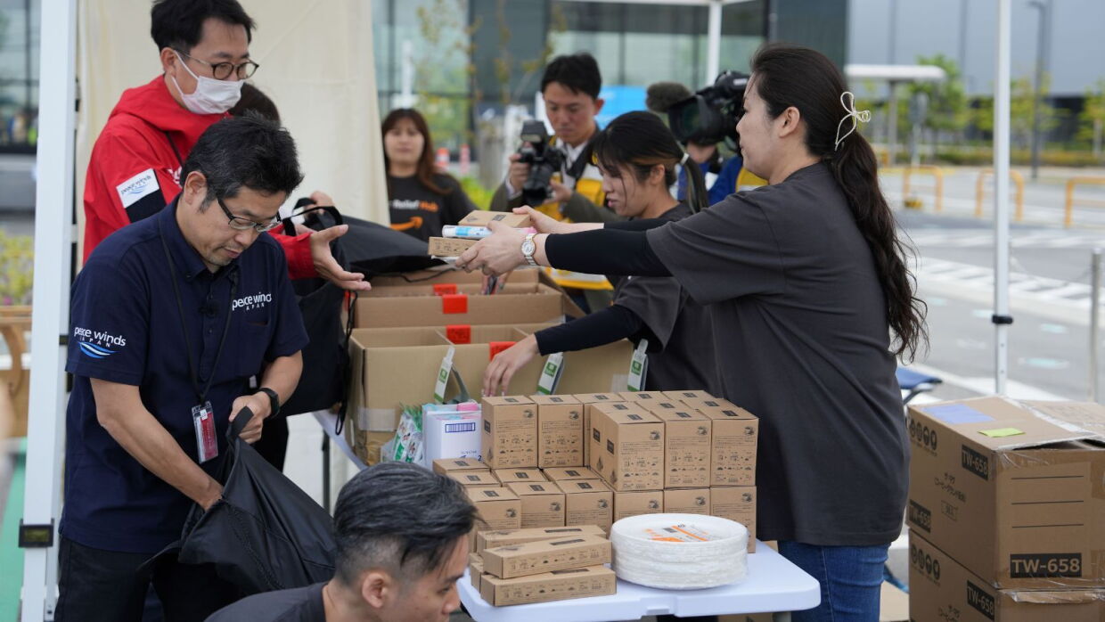 Amazon staff preparing relief kits at a Japan Disaster Relief Hub.