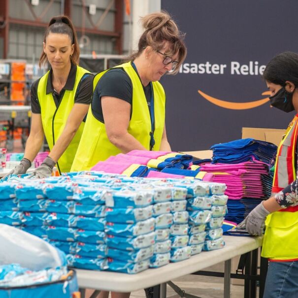 Amazon employees packing relief kits in a Disaster Relief Hub.