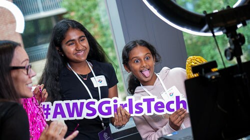 AWS Girls in Tech event with young girls smiling