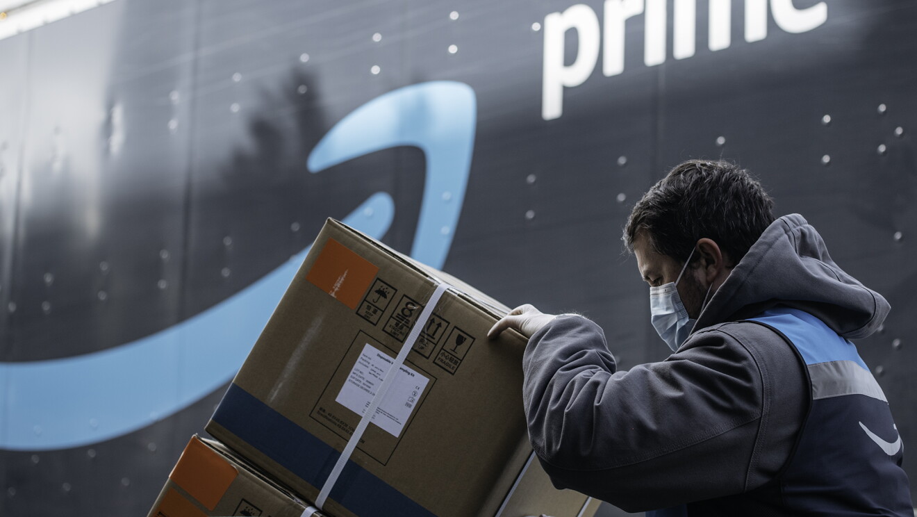An Amazon driver delivers boxes of medical supplies. 