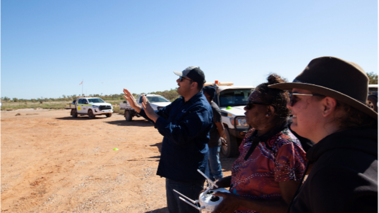 Andrew Dowding drone training indigenous rangers in the Pilbara. Image: Supplied