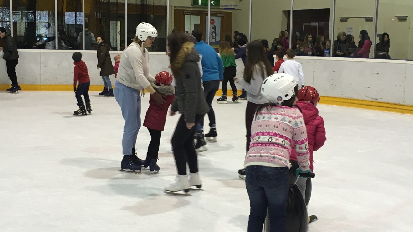 Amazon in the community takes refugees ice skating