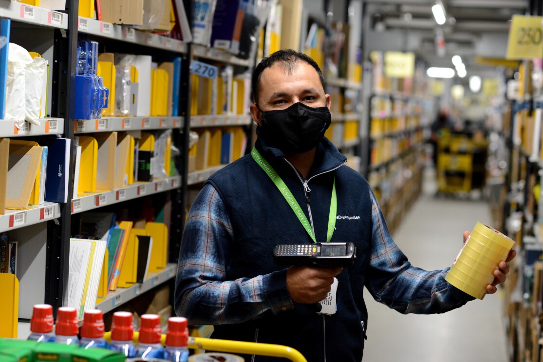 Junaid Hussain scanning items in a Fulfilment Centre in Peterborough.