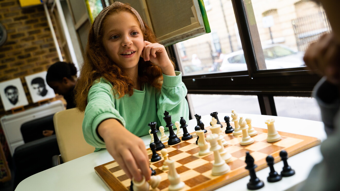 In Kind Direct children playing chess