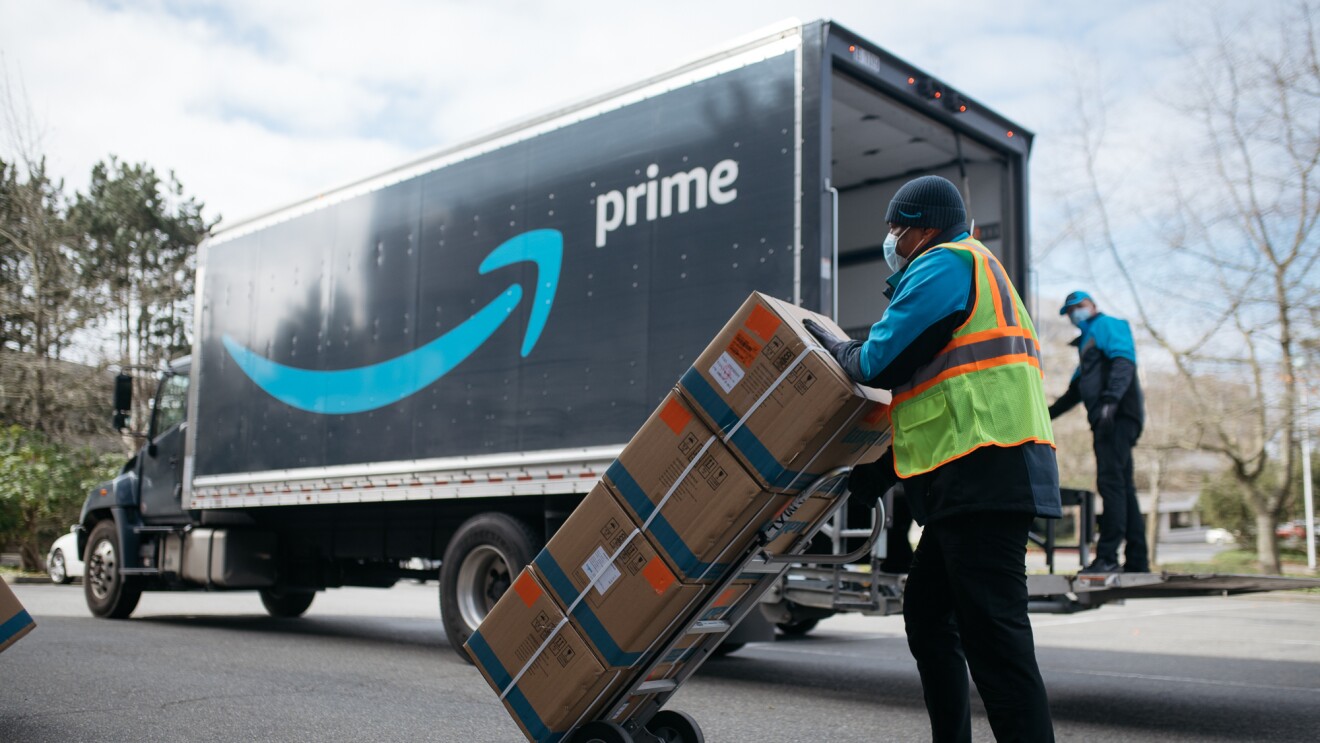 An Amazon driver delivers boxes of medical supplies. 