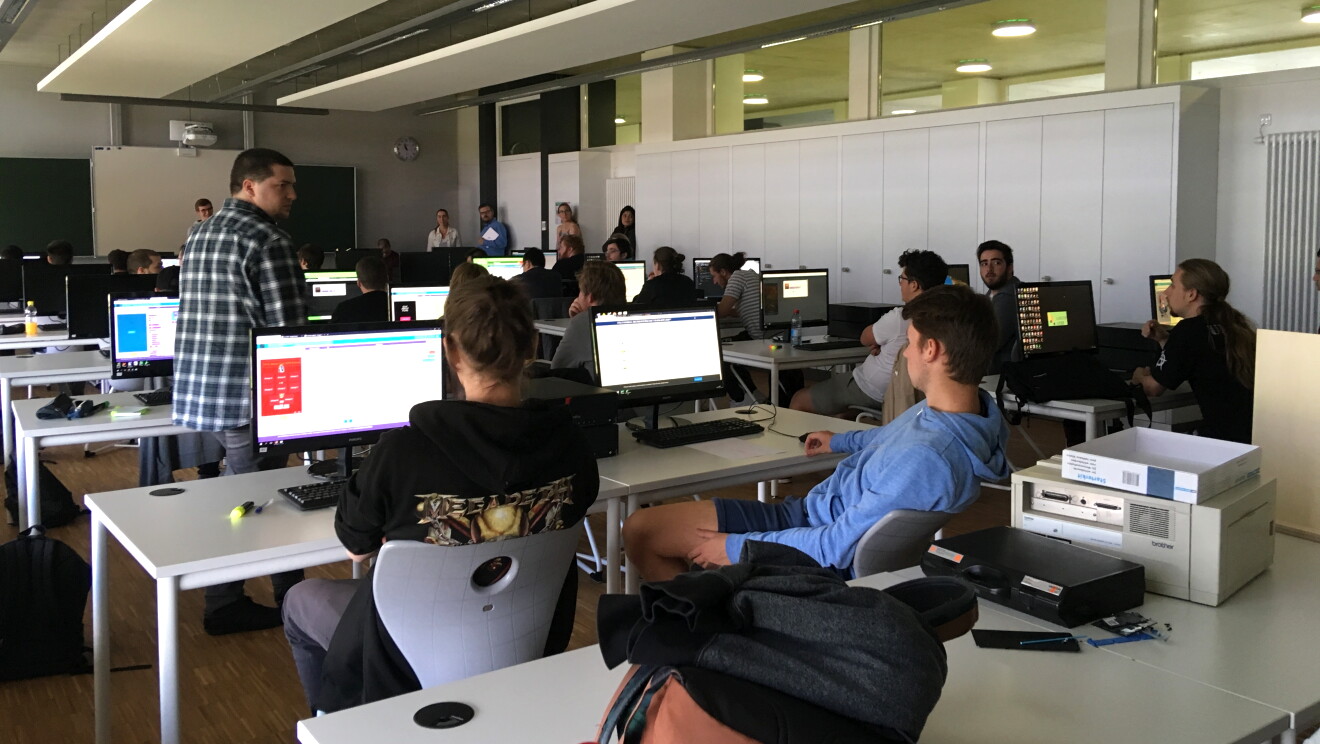 Students practice coding with Amazon employees during the Hour of Code session at the lab of Lenster Lycee Luxembourg