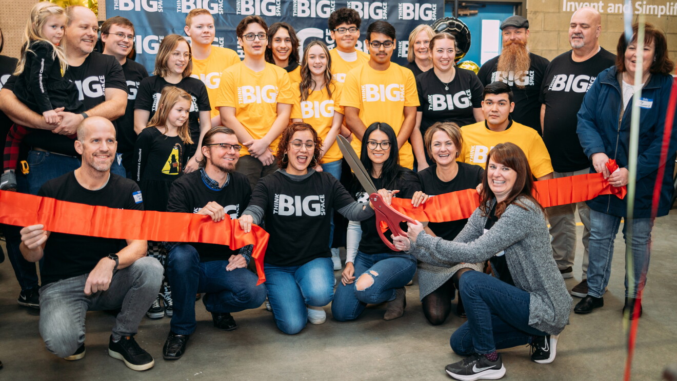A photo of a group of students and teachers at a ribbon cutting of an AWS Think Big Space in eastern Oregon.