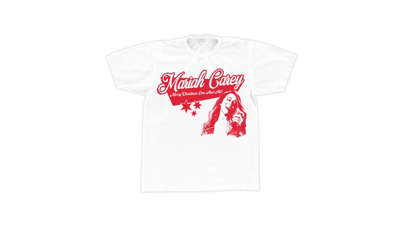 A white t-shirt with red lettering that says "Mariah Carey" there is a red illustration of Mariah singing and red stars under the lettering.