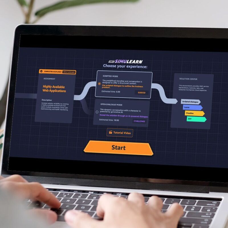Hands typing on laptop keyboard displaying SimuLearn
