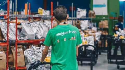 An employee packing an order at the Amazon Fresh Fullfilment Centre Singapore