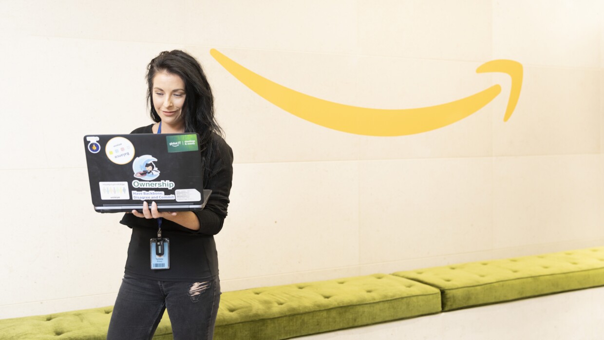 AWS female employee working on laptop