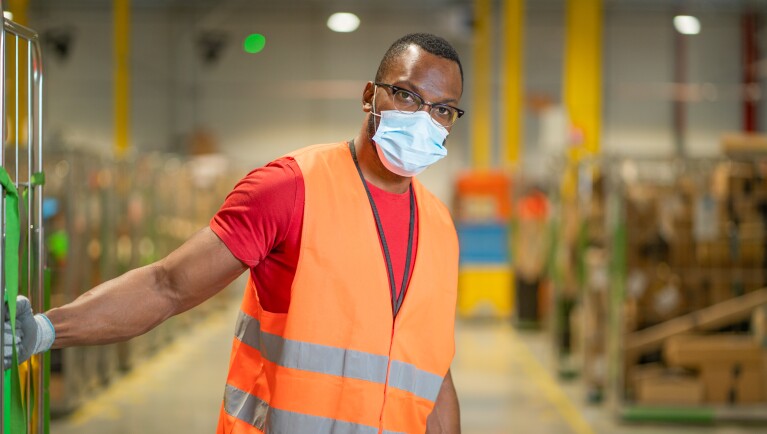 Photos of Amazon associates working in a Fulfillment Center in France.