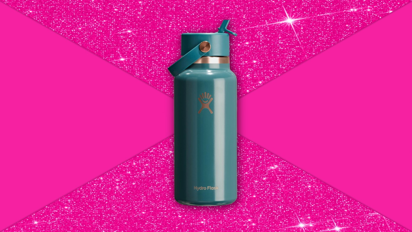 Teal Hydro Flask water bottle against vibrant pink glittery background