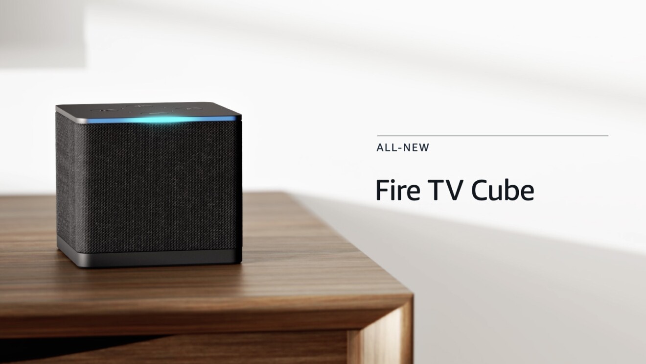 An image of the Fire TV Cube sitting on a wooden table with a white background and text on the left that reads "All-new Fire TV Cube."
