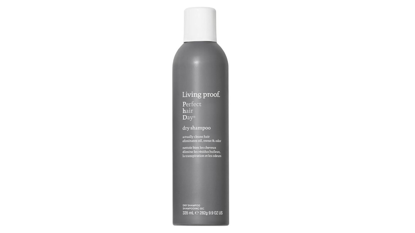 An image of the Living Proof dry shampoo. It's a cylinder shape in a clay green color.