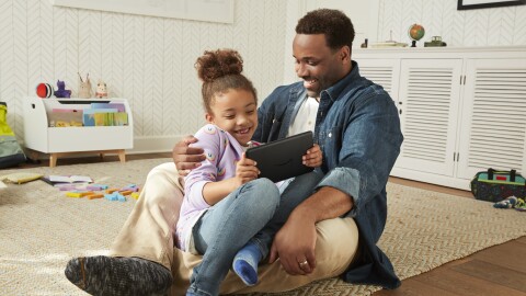 Father and daughter use a Fire Tablet