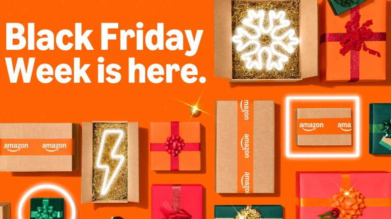 Amazon Black Friday Week promotion with festive gift boxes and neon signs