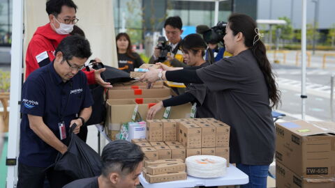 Amazon staff preparing relief kits at a Japan Disaster Relief Hub.