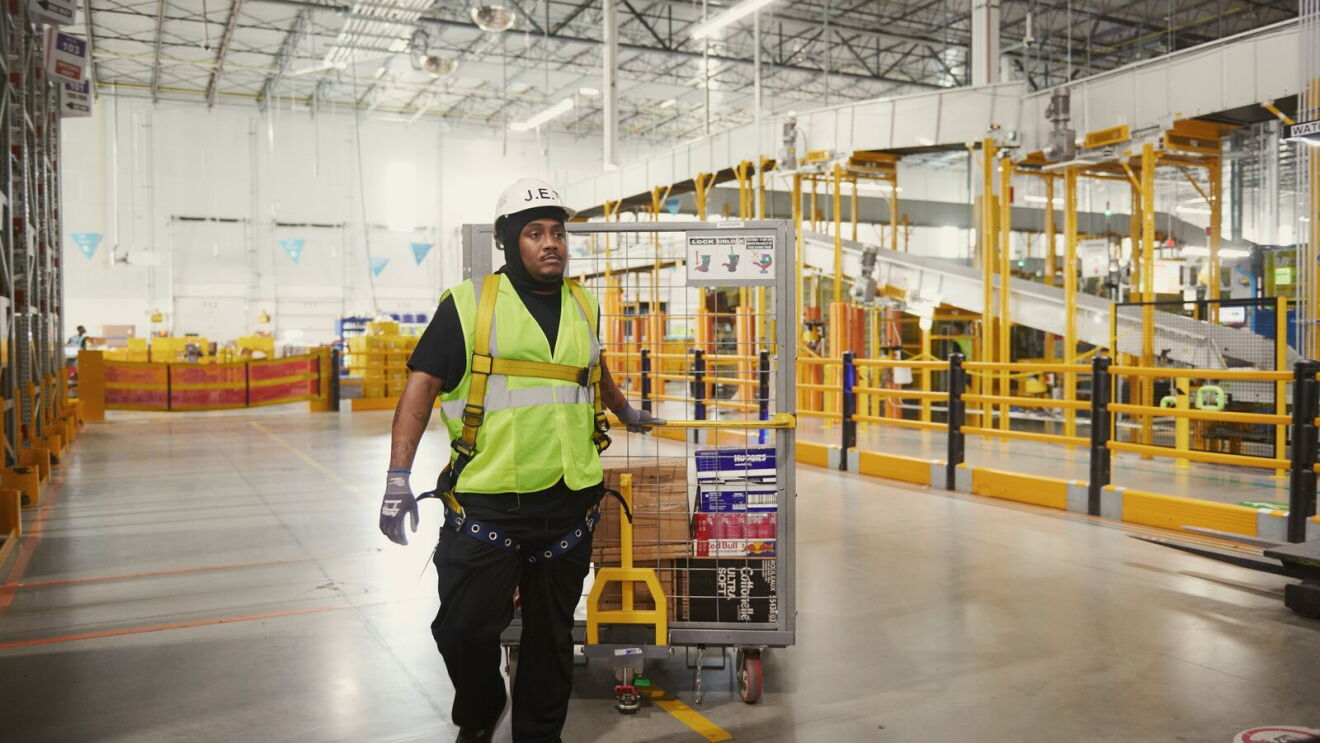An Amazon team member moves stock through same-day delivery fulfillment center SMO1