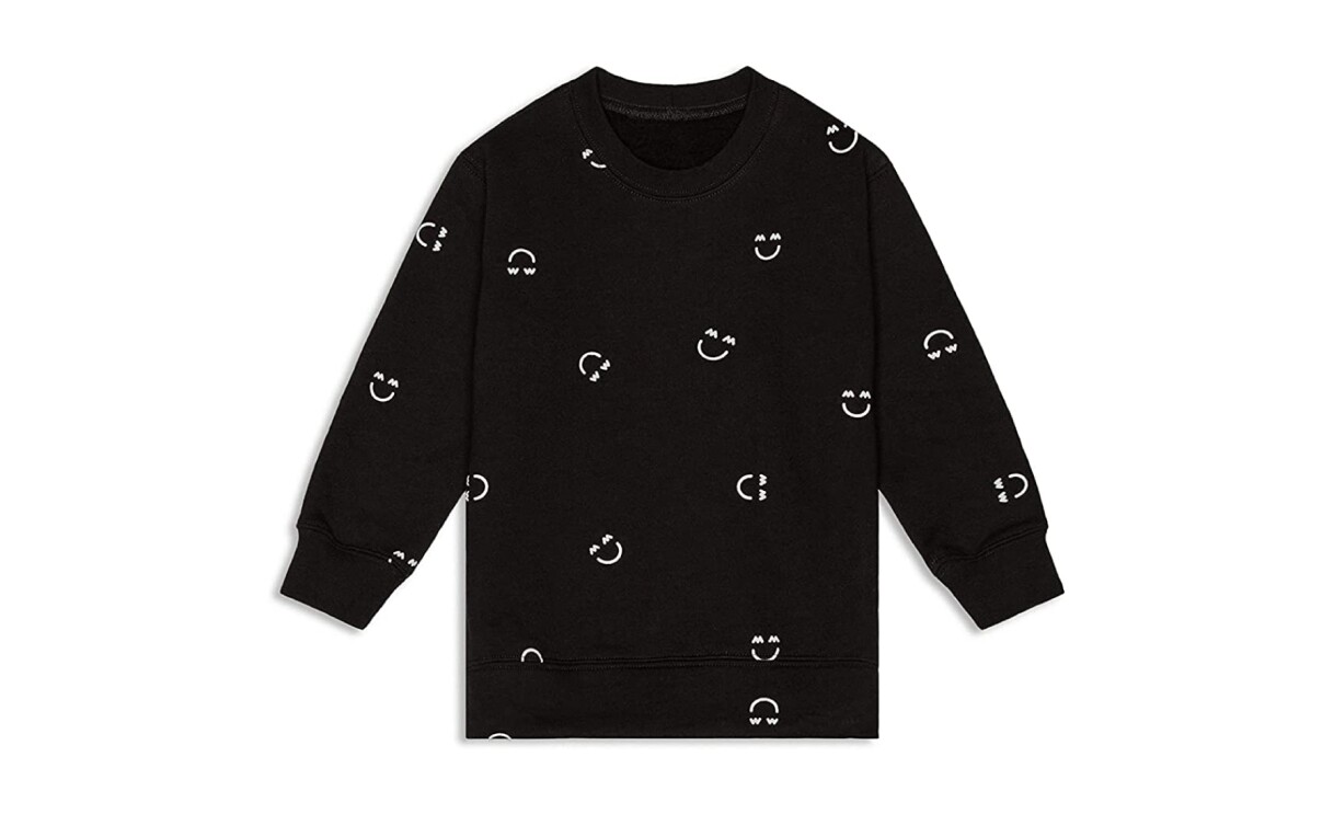 A product image of neutral baby clothes from Miles and Milan.