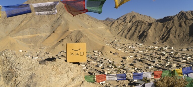 An Amazon box against the backdrop of Leh