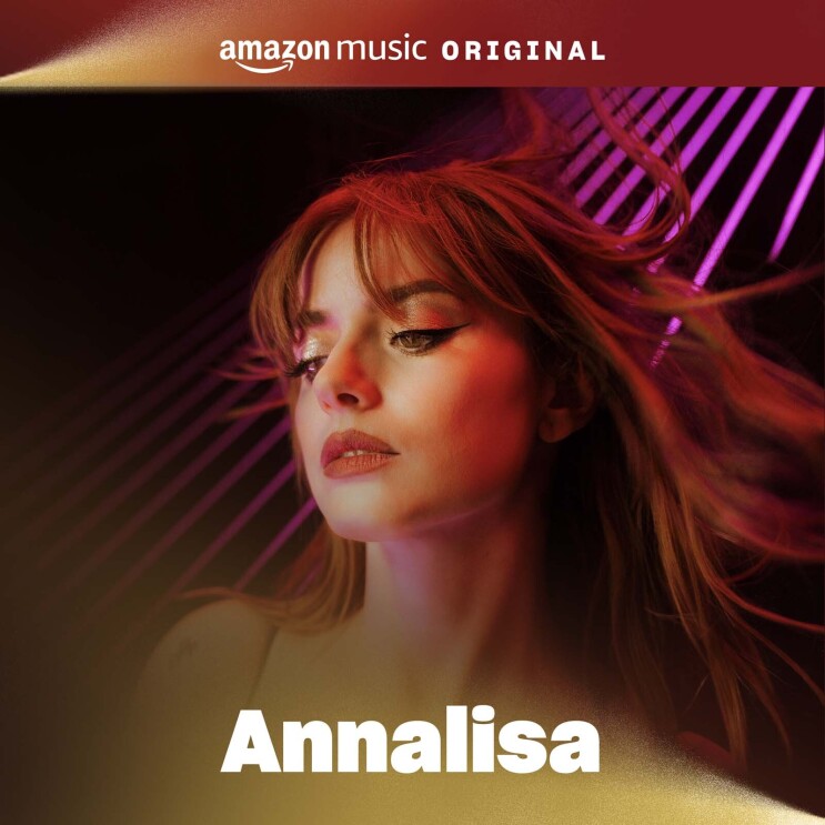 The cover art for Analeisa's song. It features a portrait of Analeisa with a black background and shining neon lights behind her. She is gazing slightly down at the floor below the camera.