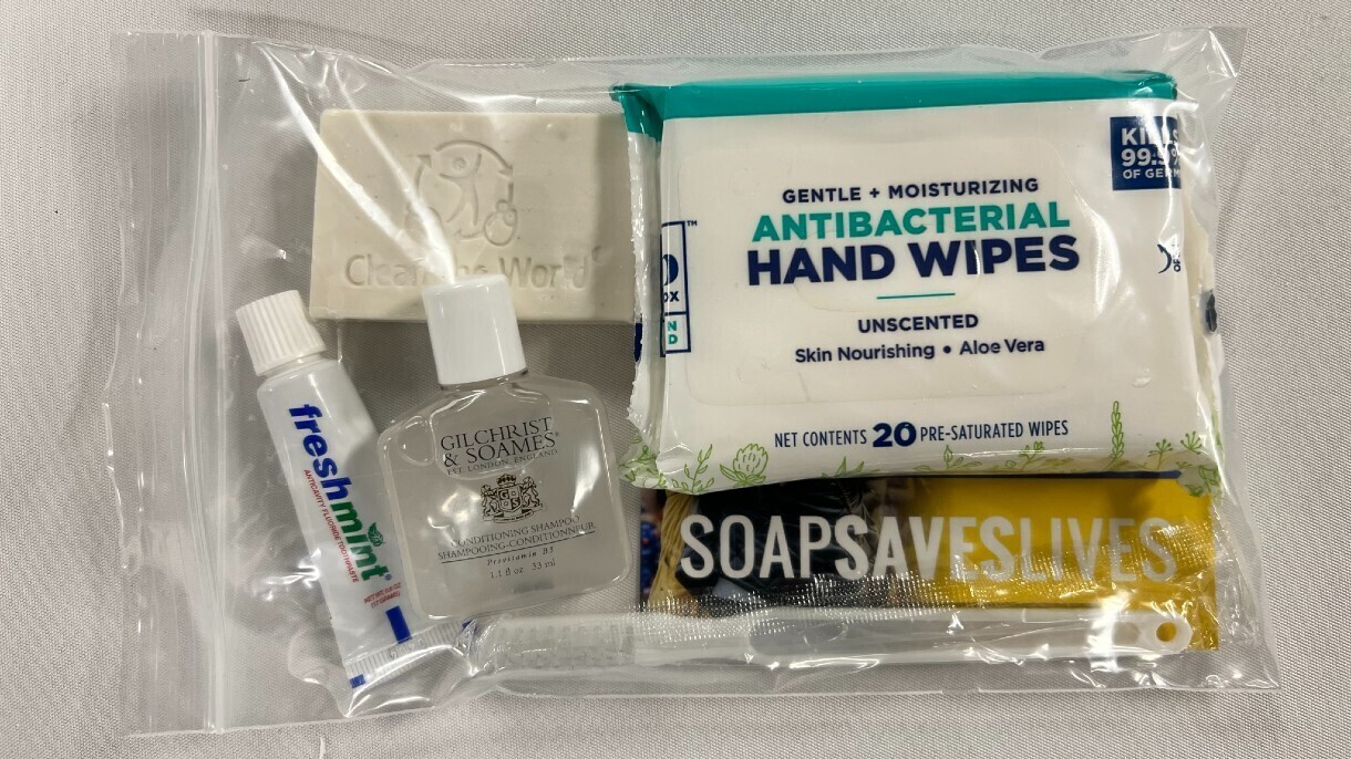 A close up of an Amazon donated kits which consists of basic supplies—including soap, shampoo, tooth brush, toothpaste, and hand wipes.