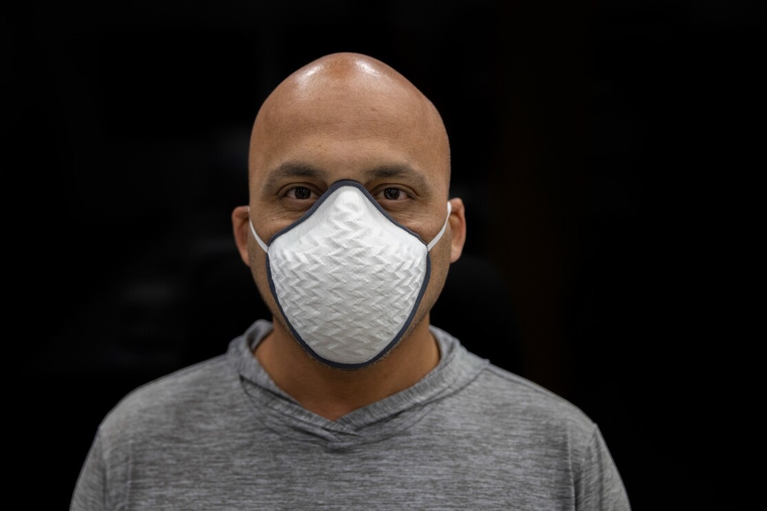 Tushar Mahale wears a face mask.