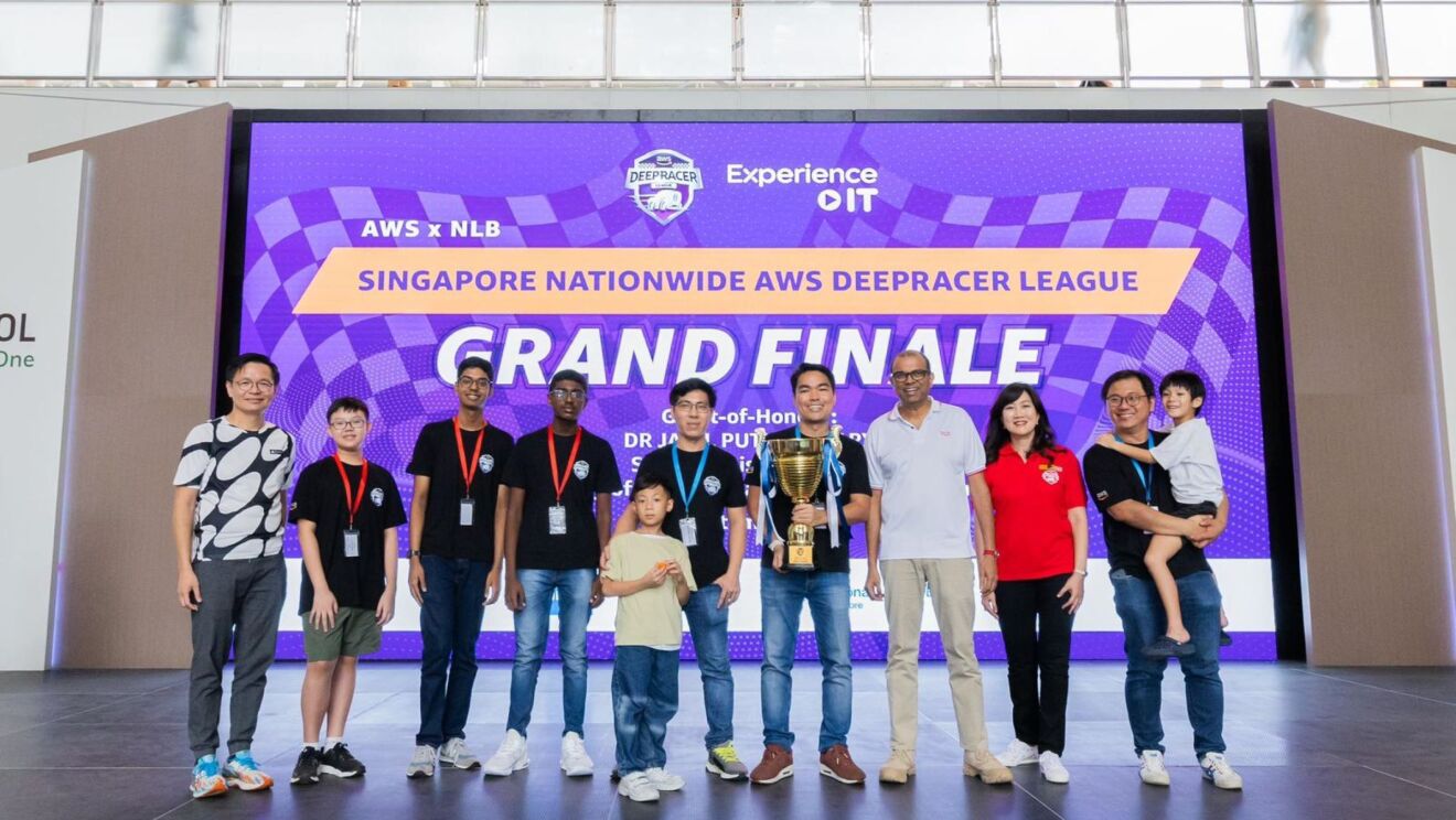 People posing for a photo on stage