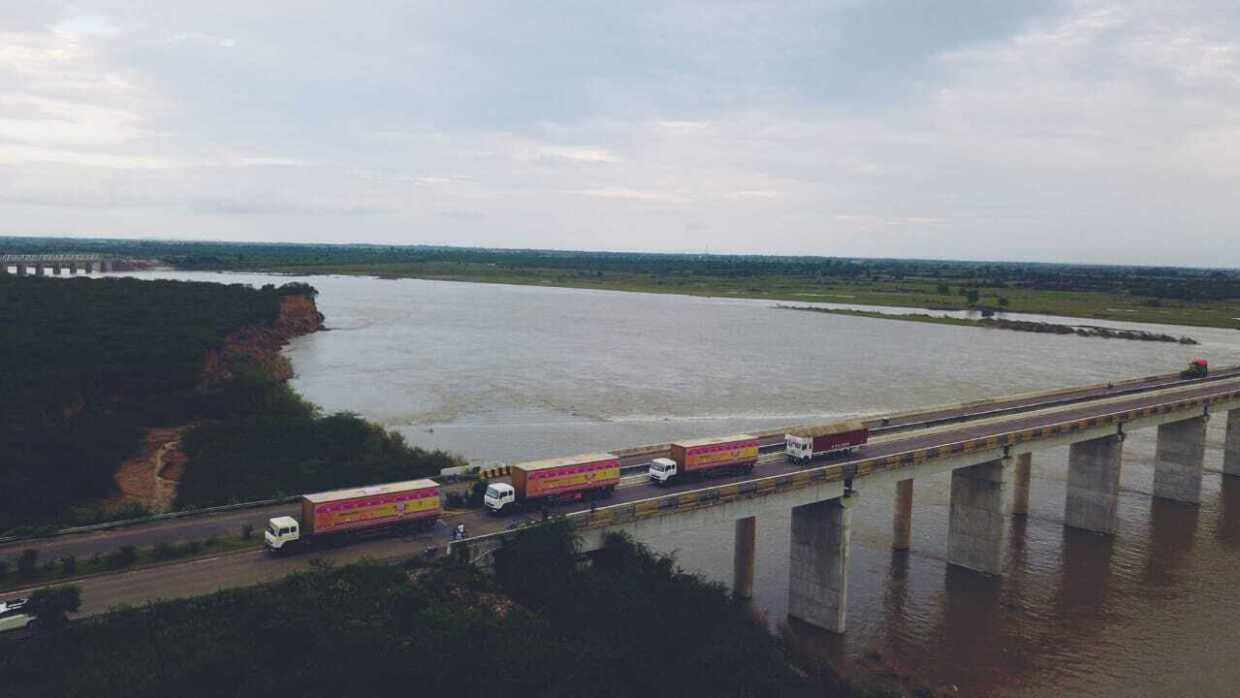 Amazon Yatra convoy passes a bridge