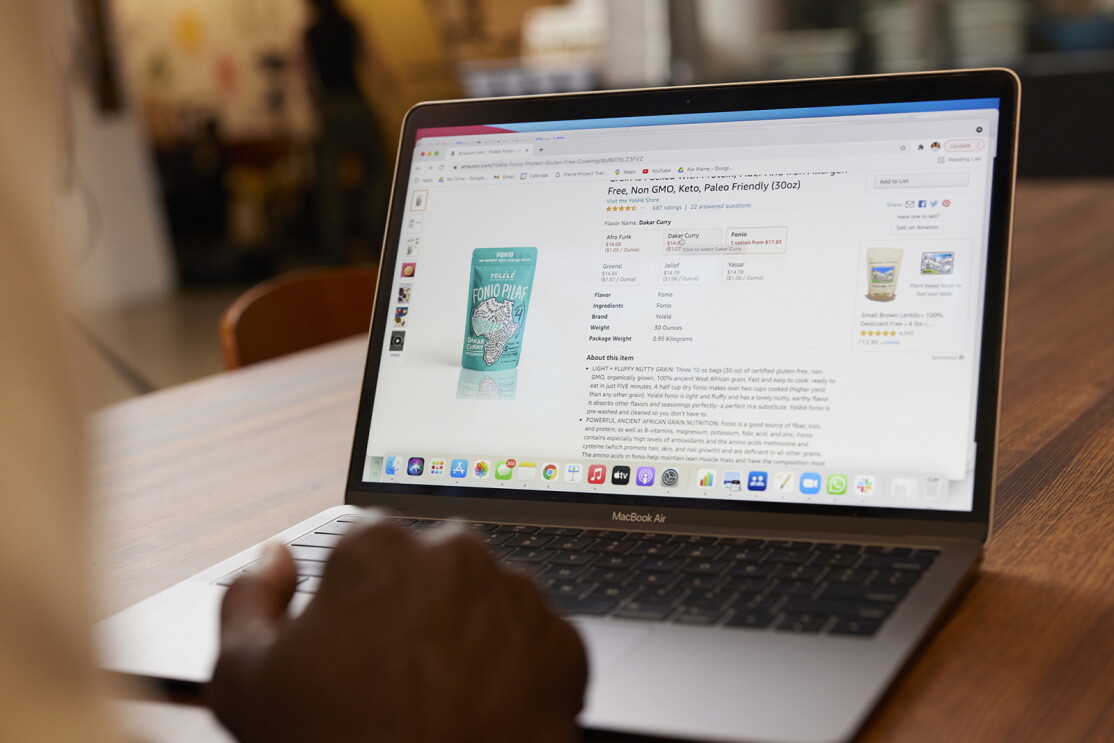 An image of a laptop. On the screen is a product page for "Fonio Pilaf" rice.