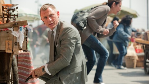 A tense moment captured in a bustling marketplace, taken from Skyfall