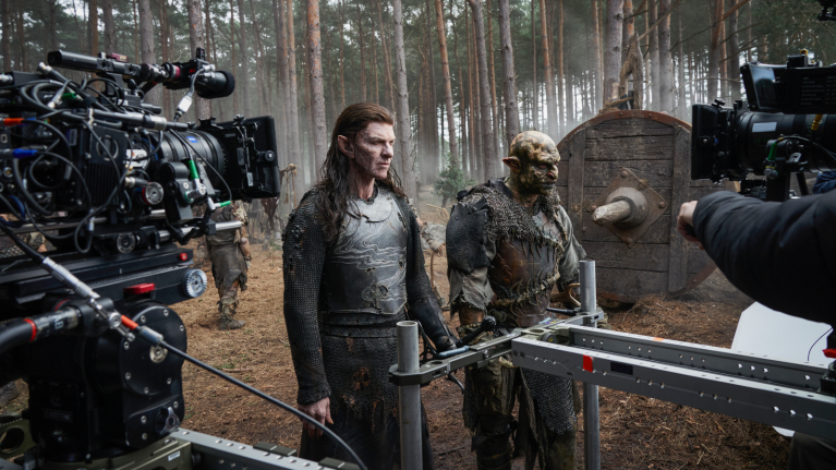 Camera crew filming fantasy TV show, with actors in elven costume