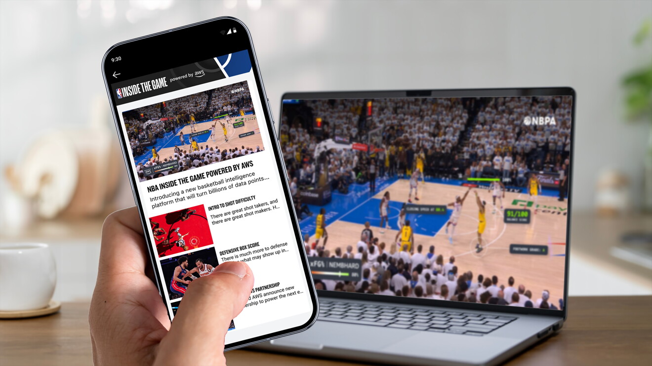 NBA Inside the Game app on smartphone next to laptop showing live basketball game using AWS insights