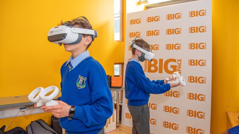 A photo of students using Virtual Reality at the AWS Think Big Space in Ireland.