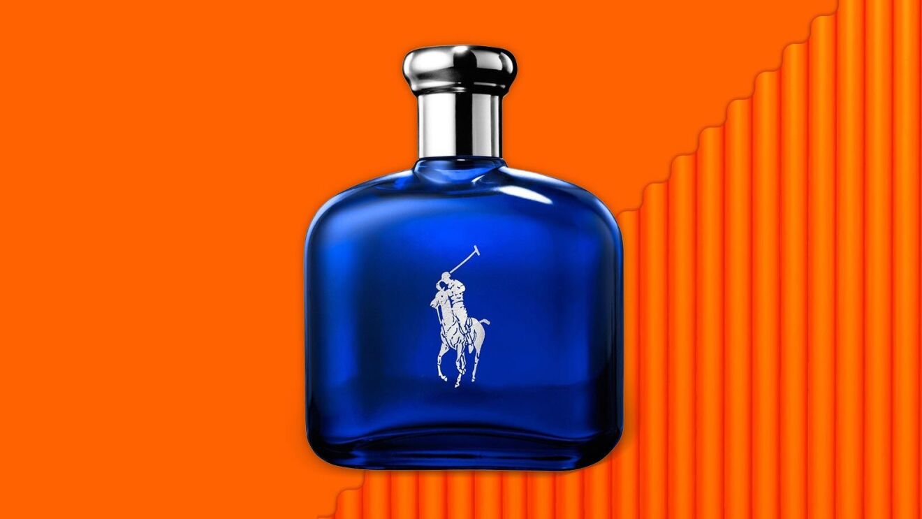 Blue Ralph Lauren Polo cologne bottle on vibrant orange background