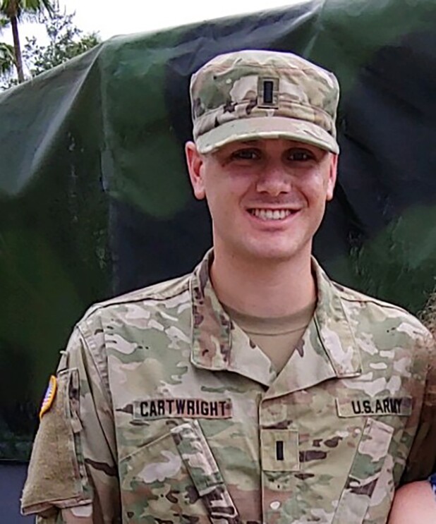 A man wearing a National Guard uniform in a military setting