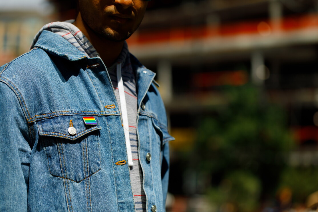 denim jacket with rainbow flag on pocket to support glamazon 