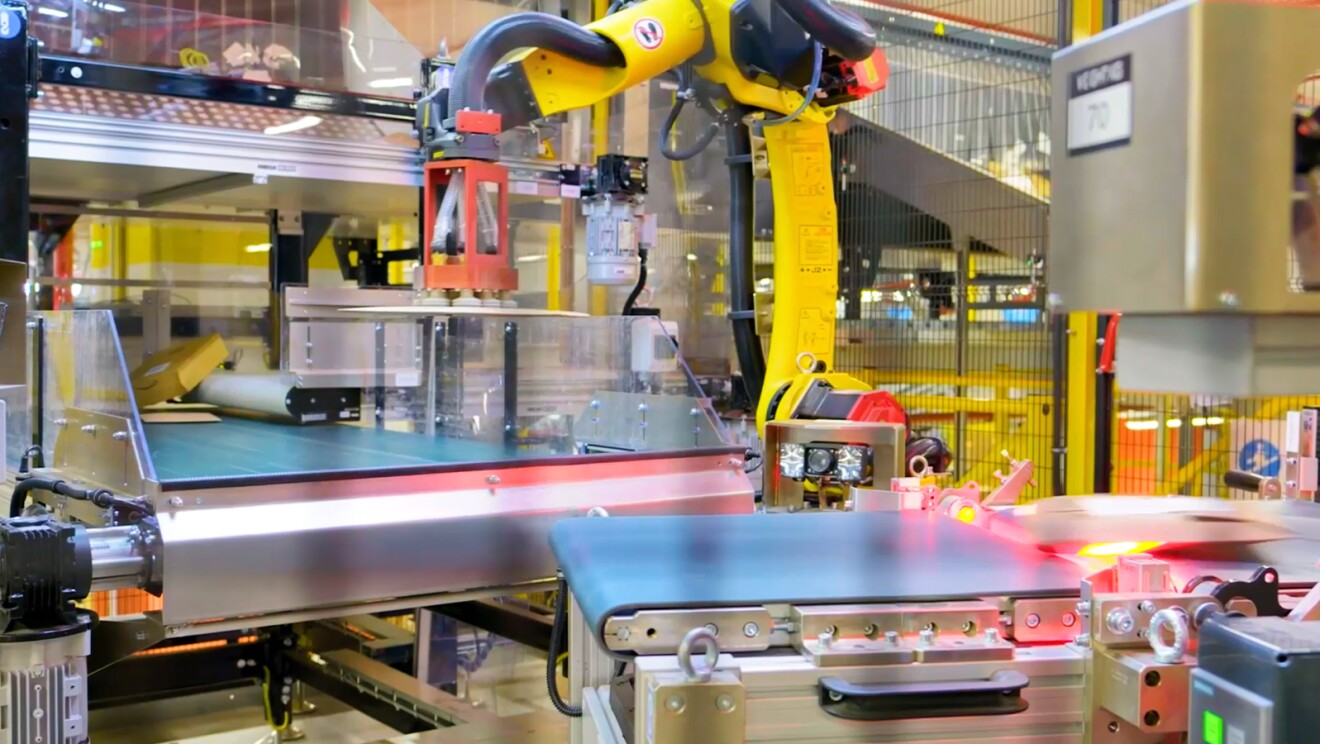 Amazon Innovation Amazon employee operating a robot sorter