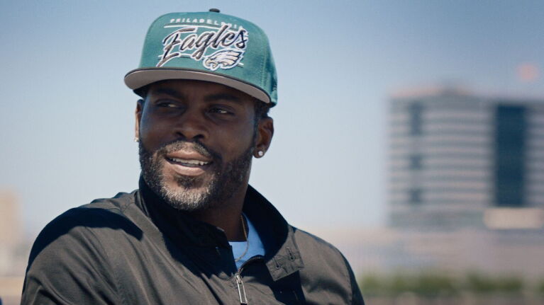 Former NFL quarterback Michael Vick talks during an interview.