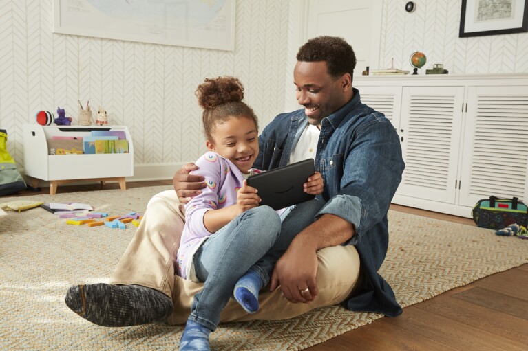 Father and daughter use a Fire Tablet